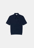 Packshot de face du polo Lacoste en maille torsadée bleu marine avec col polo à boutons.