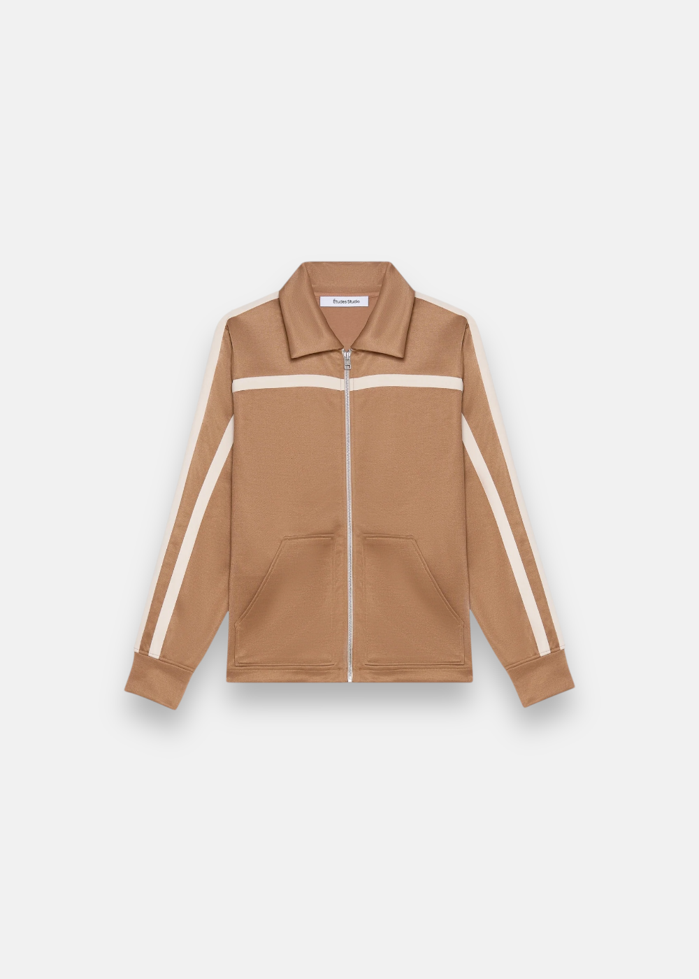Veste de survêtement Études Studio marron avec fermeture éclair, vue de face sur fond neutre.