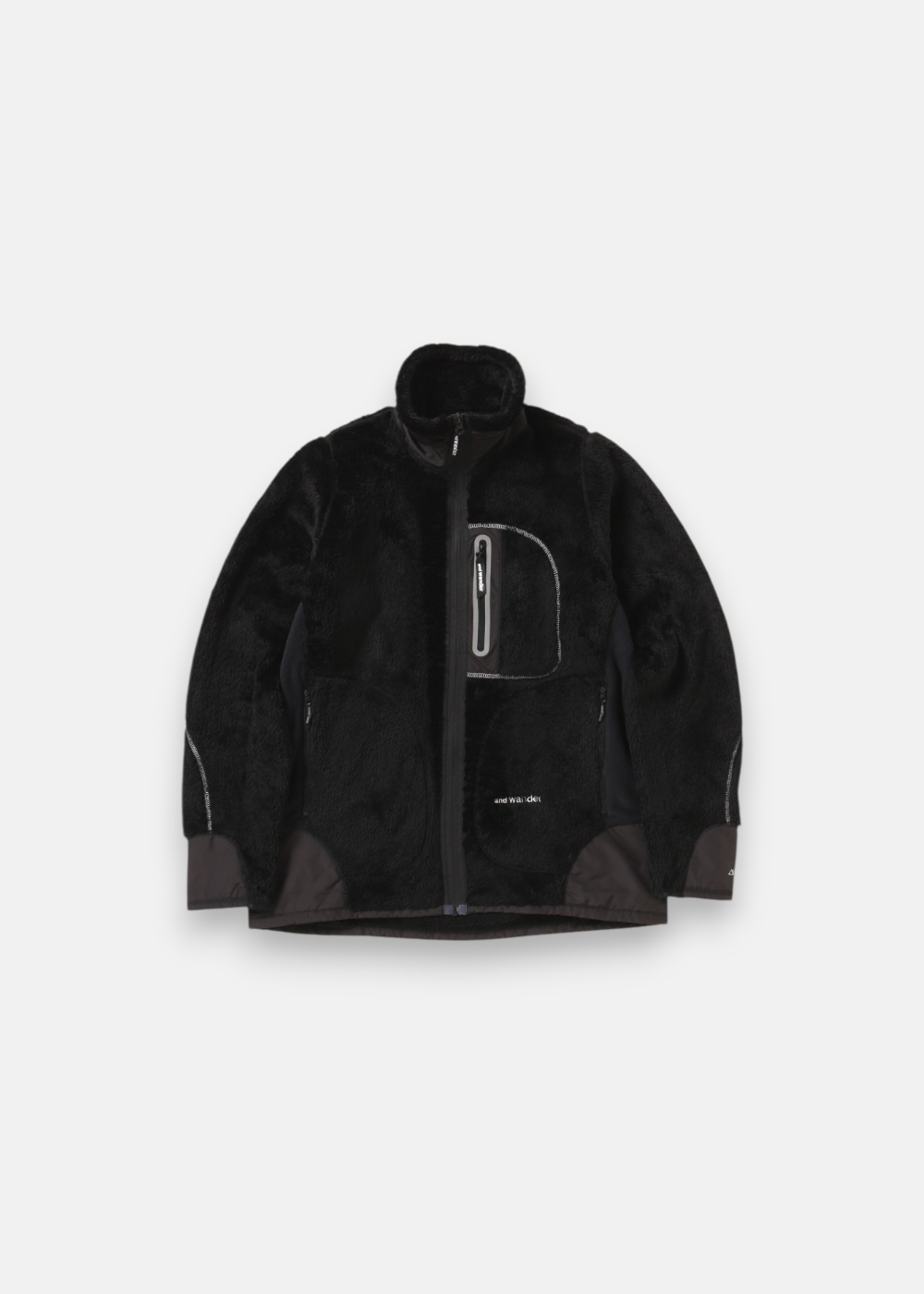 Veste polaire And Wander High Loft noire, chaude et technique, fermeture zippée intégrale, poche poitrine zippée réfléchissante.